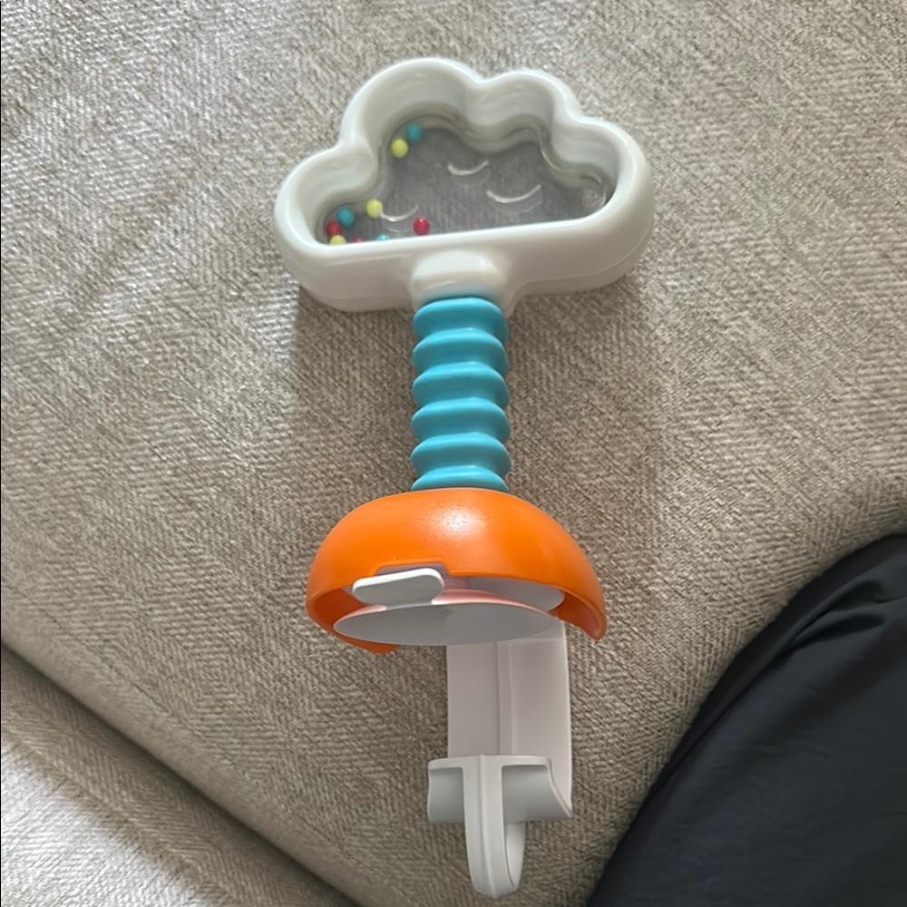 Skip hop activity center Cloud Rattle Toy with Orange and Blue Handle
